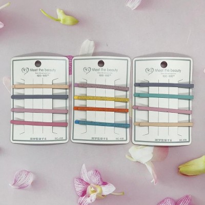 B-056 CARTON PINZA PARA CABELLO RECTO EN HIERRO CON PLASTICO COLORES